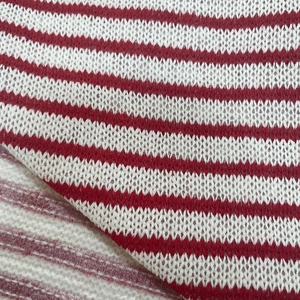 Macro shot of red and white striped knit fabric showing detailed texture and soft weave