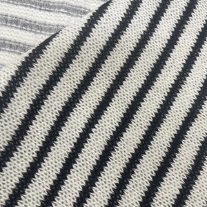Macro view of black and white striped knit fabric showing detailed fine texture