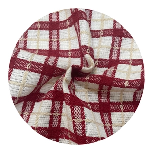 Red and white checkered knitted fabric with textured plaid pattern for Christmas decor