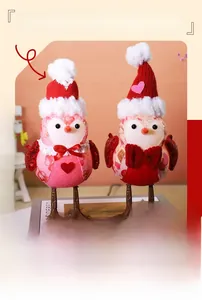 Detail of fabric couple bird ornaments with sequined wings and red knit hats for Valentine
