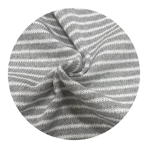 Grey and white striped knit fabric with soft texture for winter sweaters and home decor