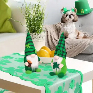 Two St. Patrick's Day green gnomes with shamrocks on a festive clover table runner