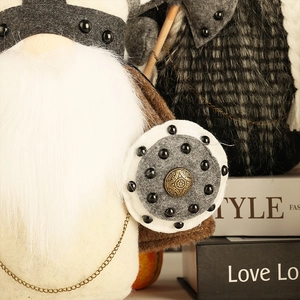 Detail of Viking gnome with long white beard, felt helmet, and warrior shield