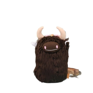 Scottish Highland Cow plush doll with long brown hair and flower decorations