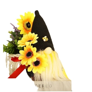 Plush sunflower gnome figurine with black bee hat and harvest festival woven basket