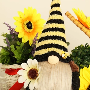 Bee-themed bumblebee gnome plush with yellow striped hat and daisy for garden decor
