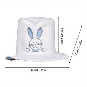 Macro view of white velvet rabbit ear hat with blue embroidery showing dimensions