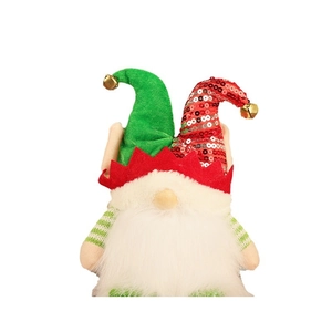 Light-up Christmas gnome plush with sequined elf hat and golden bells on white background