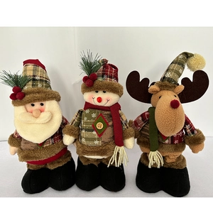 Detailed view of Christmas plush dolls featuring Santa, snowman, and reindeer figures