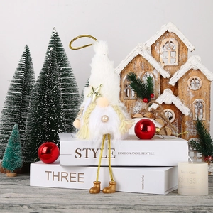 Detail of white plush Christmas gnome with golden star and pearly beard decoration