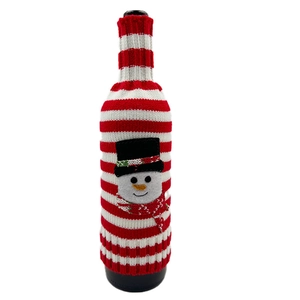 Knitted Christmas wine bottle cover featuring a red and white stripe snowman design