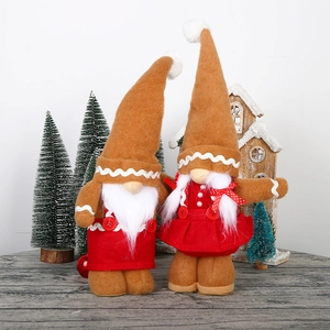 Pair of khaki gingerbread Christmas gnomes with pointed hats and festive knit outfits
