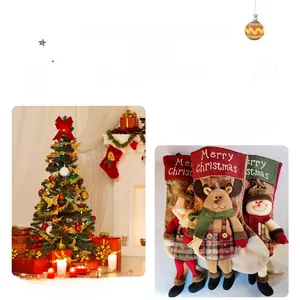 Close-up of three 3D Christmas stockings featuring Santa, Snowman, and Reindeer themes
