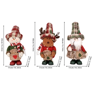 Three Christmas plush figurines: Santa, Snowman, and Reindeer in burlap aprons on white background