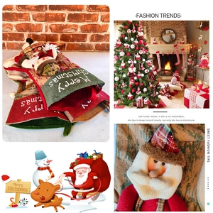 Detail of knitted Christmas stockings with snowman decor and Merry Christmas text embroidery