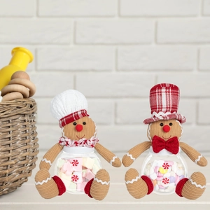 Detail of Christmas gingerbread man candy jars with festive hats and ribbon bows