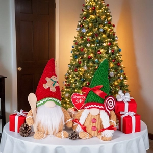 Gingerbread Christmas gnomes set with knitted hats and festive accessories on a white table