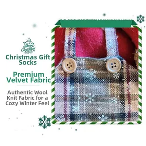 Detailed view of red and green plaid Christmas stocking with snowflakes and wood buttons