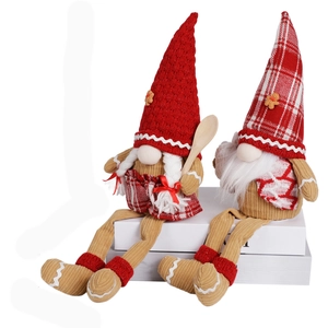 Pair of festive Christmas gnome dolls with gingerbread motifs and red knitted hats