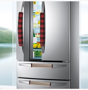Detail of red and black plaid and tan linen refrigerator handle covers for kitchen decor