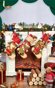 Three Christmas stockings with Santa, snowman and reindeer hanging on a fireplace mantel