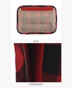 Macro detail of red and black buffalo plaid handle cover with durable hook and loop closure