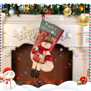 3D snowman Christmas stocking gift bag hanging by a fireplace with plaid details