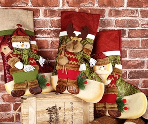 Detailed close-up of 3D Santa, Elk and Snowman Christmas stockings with burlap and faux fur