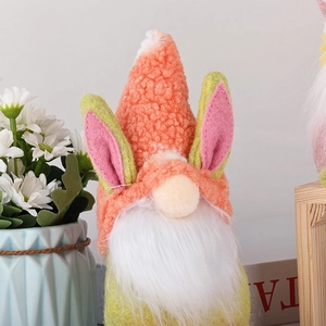 Close-up of Easter gnome with orange textured hat and plush white beard decorations