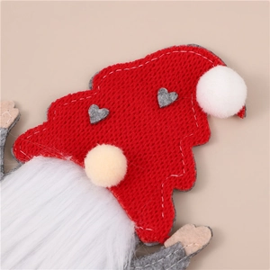 Close-up of red knitted Christmas gnome hat with plush ball and soft white beard detail