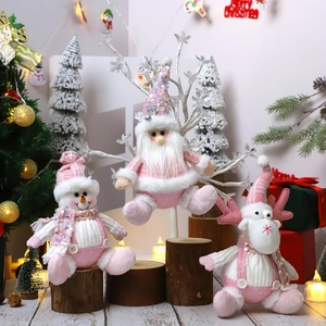 Pink Christmas plush figurines set featuring Santa, snowman and elk on wooden stumps