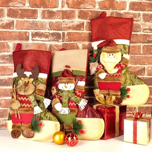 Three-piece Christmas stocking set featuring 3D Santa, reindeer and snowman decorations