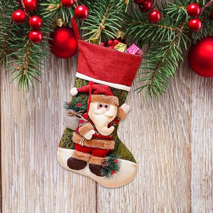 Classic red and green Christmas stocking with 3D Santa applique and gift decorations