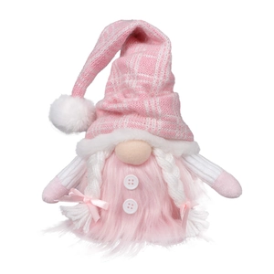 Detail of pink knitted Christmas gnome with braided hair and plush fabric texture