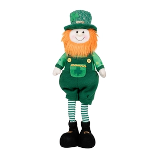 Macro detail of St. Patrick's Day gnome doll with green clover hat and orange beard