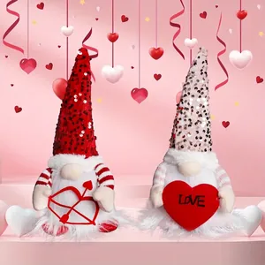 Pair of lighted Valentine Gnomes with sequins and heart accessories on pink background