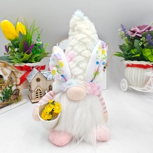 Easter Gnome plush with bunny ears and white beard holding a mini flower bucket