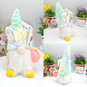 Easter gnome plush doll with bunny ears holding pink egg, front and back view