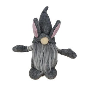 Detail of gray Easter gnome with rabbit ears, knitted striped arms and soft long beard