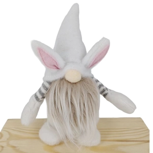 Close-up of Easter gnome with plush white rabbit ears and gray striped sleeves on wood base