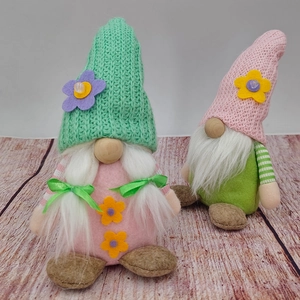 Detail of knit hats and braided hair on these colorful spring gnome plush figurines