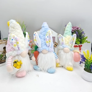 Detailed close-up of Easter gnome plush toys with bunny ears, carrot and egg accessories