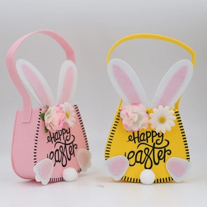 Detail of Happy Easter felt bags with 3D bunny ears and floral decorations in pink and yellow