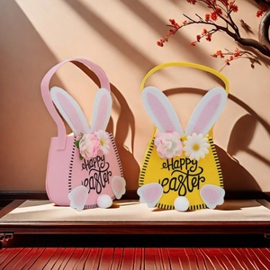 Detailed view of pink and yellow felt Easter bunny bags with Happy Easter text and pom tail