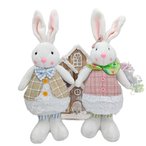 Standing plush Easter bunny couple figurines with plaid outfits and soft fur texture