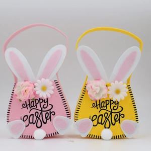Detail of pink and yellow felt Easter bunny bags with Happy Easter text and fluffy tails