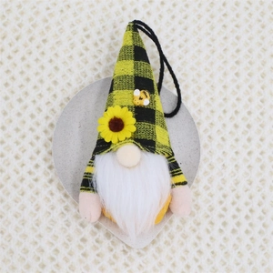 Detail of bee festival gnome with sunflower pattern and yellow checkered hat for hanging