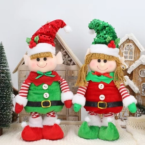 Close-up of plush Christmas elf dolls with sequin hats on a cozy holiday setting
