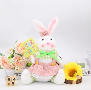 Easter plush bunny decoration in pink dress holding an Easter Hunt sign for home decor