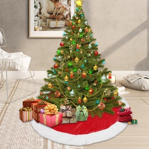 Classic red Christmas tree skirt with white plush trim and quilted texture detail